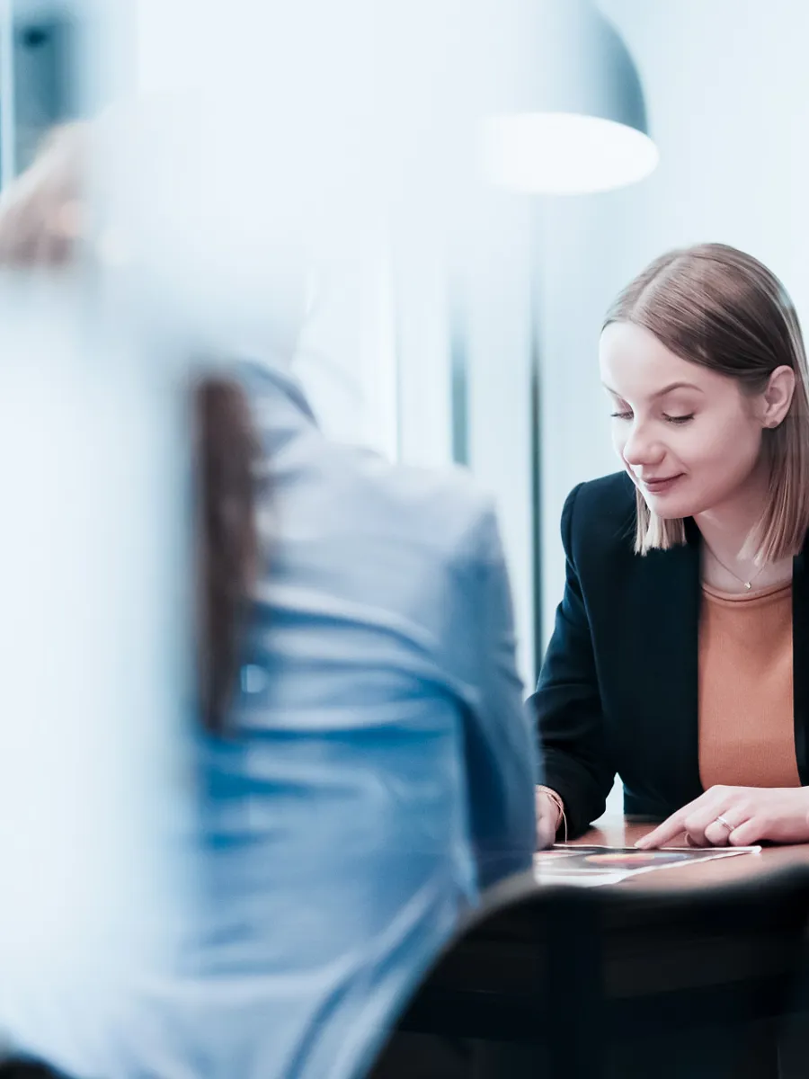 Two women in conference room