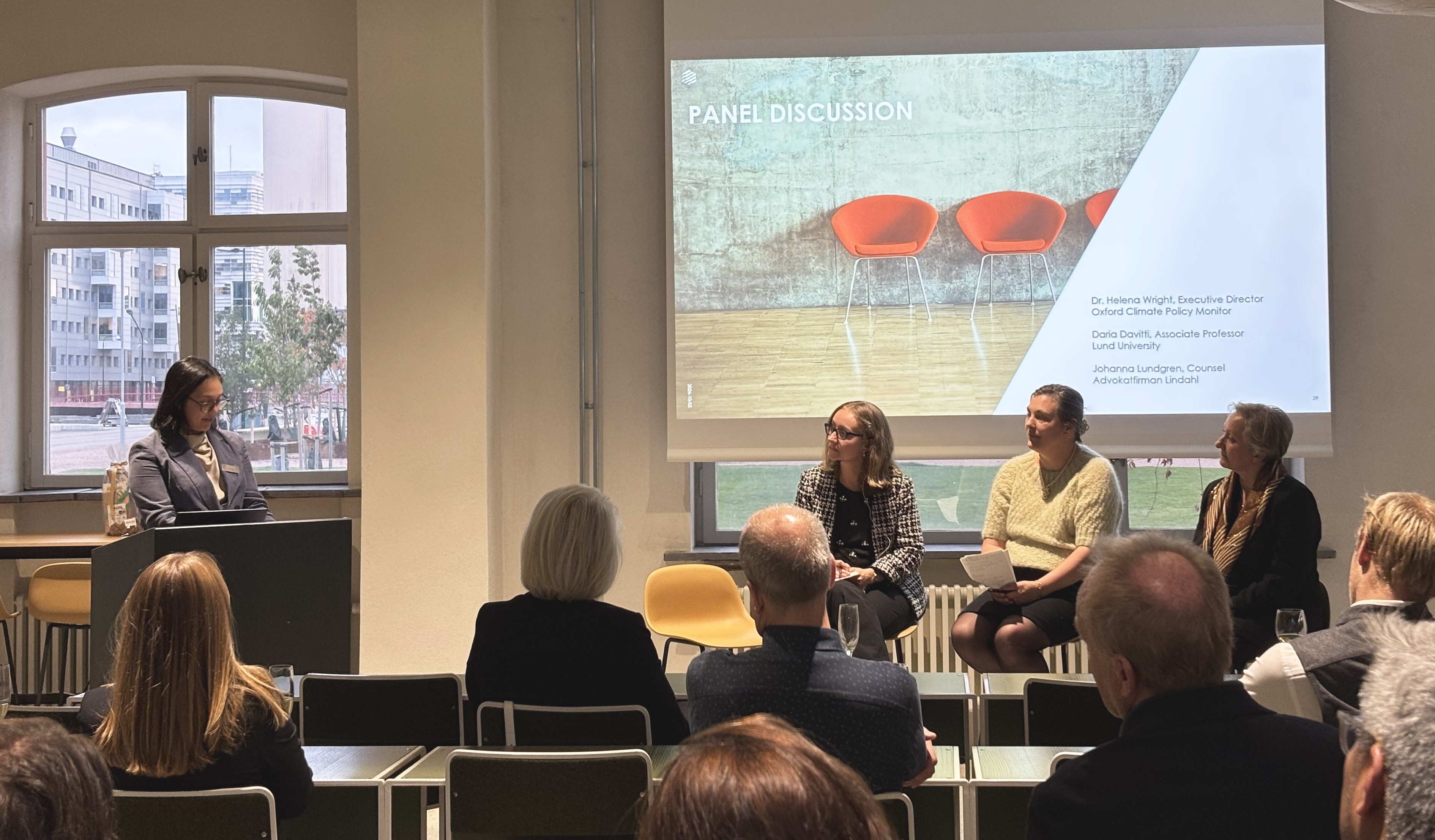 Panel discussion with four women in front of audience 
