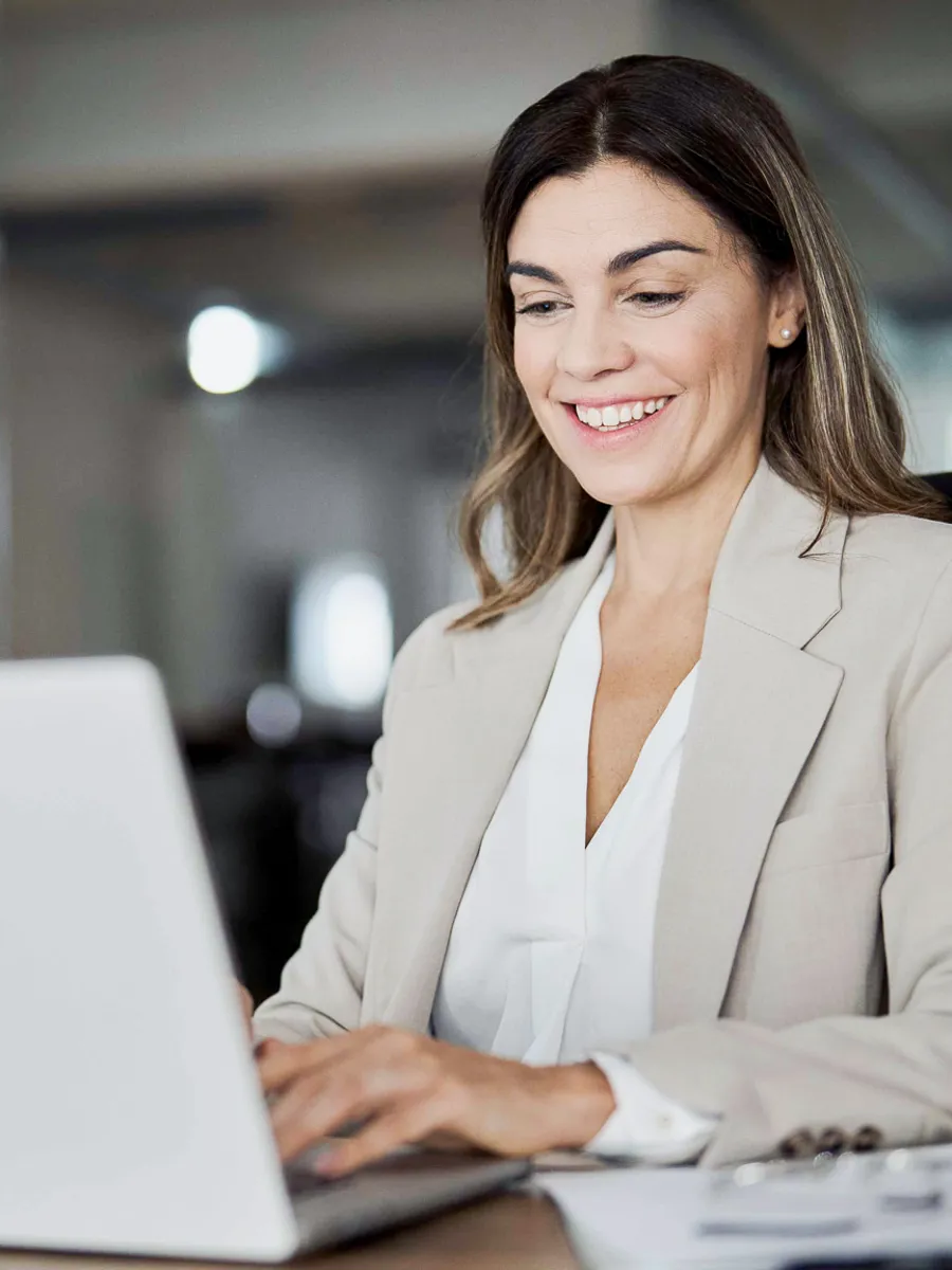 Woman in online meeting at her laptop