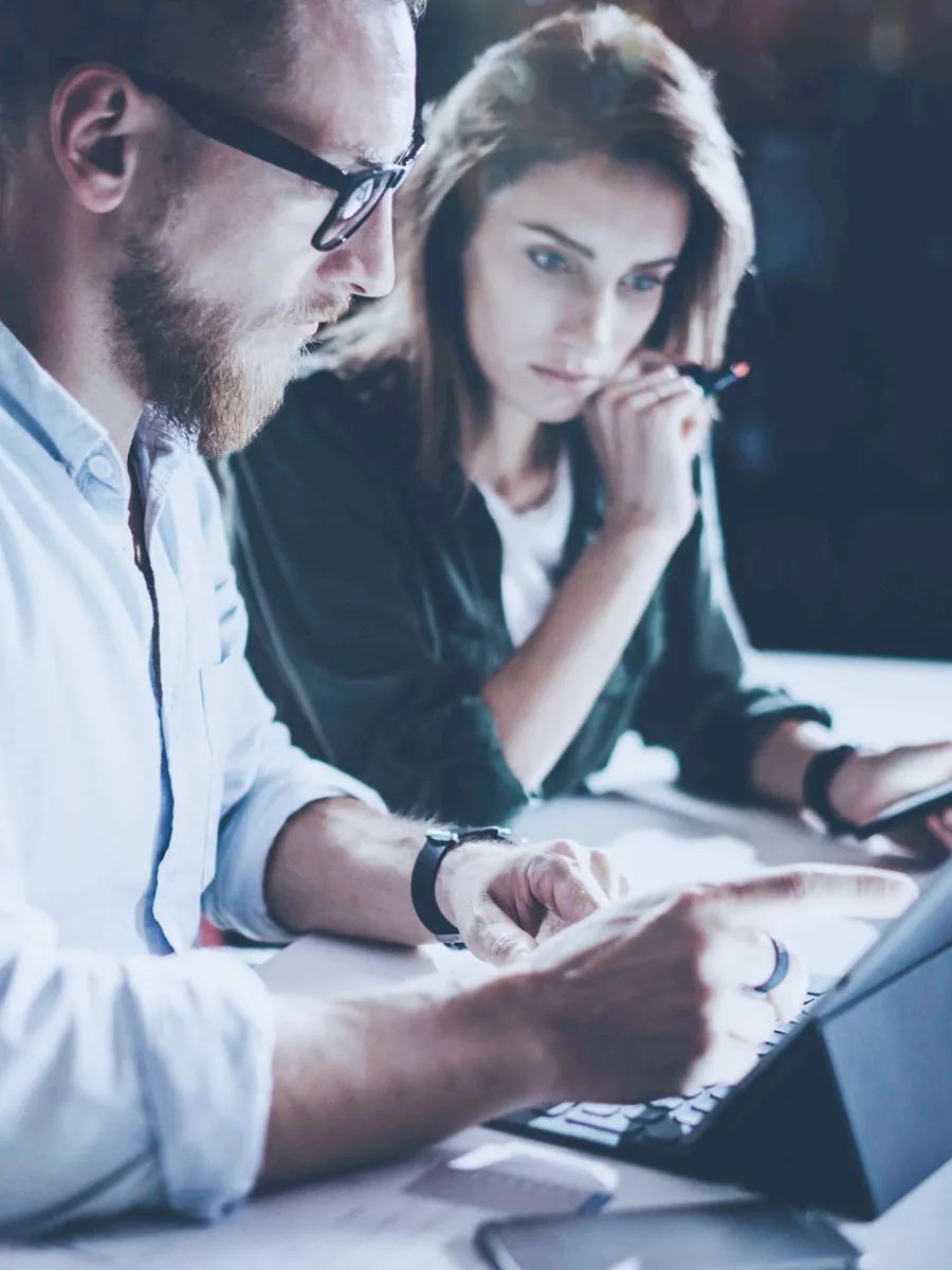 Two people looking at a computer screen