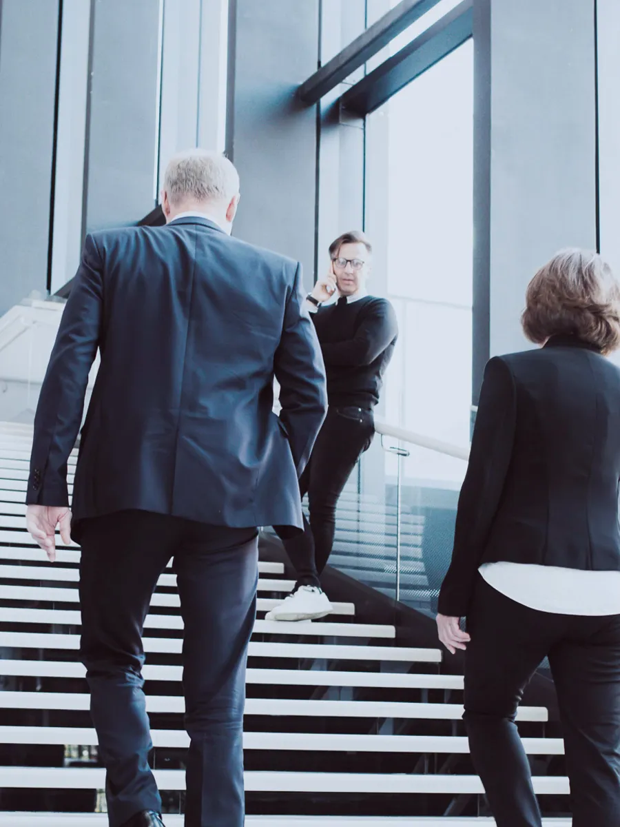 Business people wakling in stairs