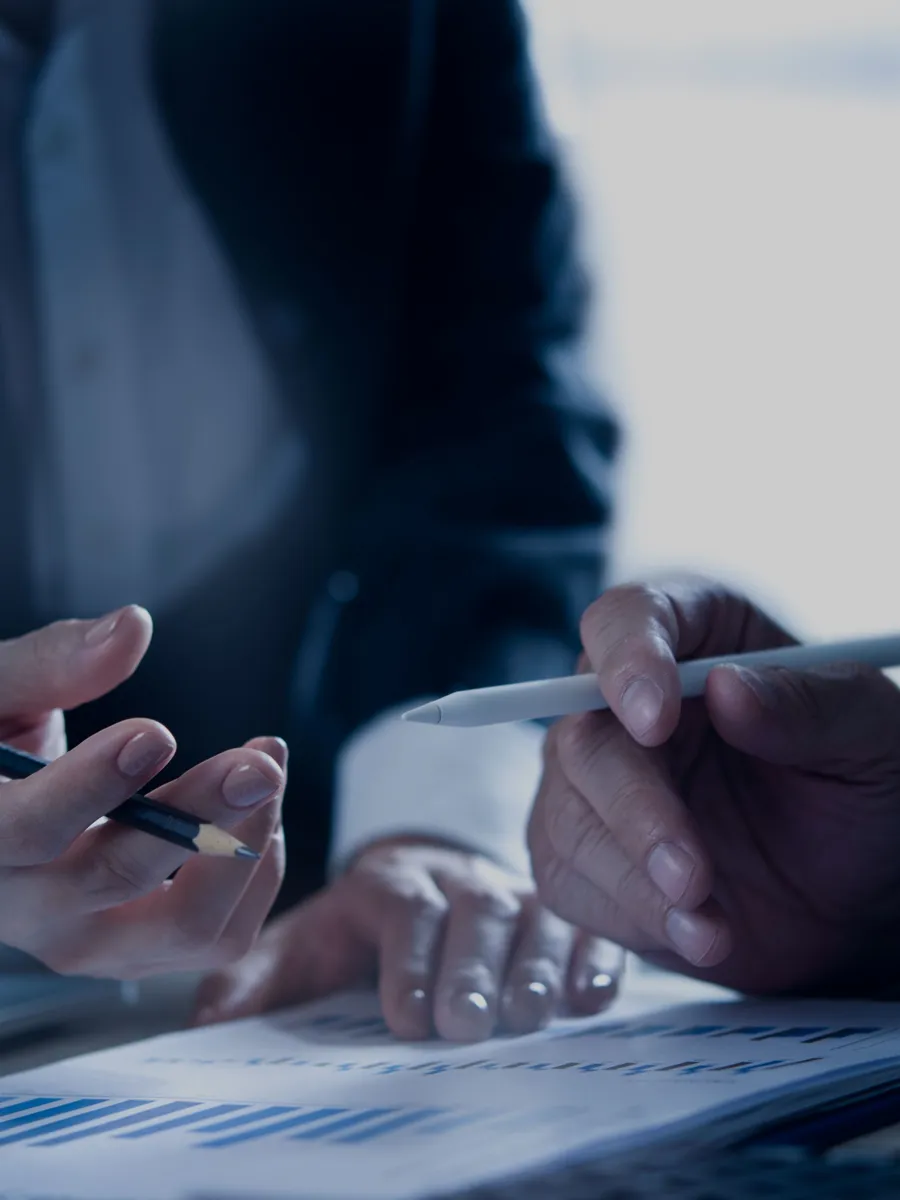 Two people discussing a document