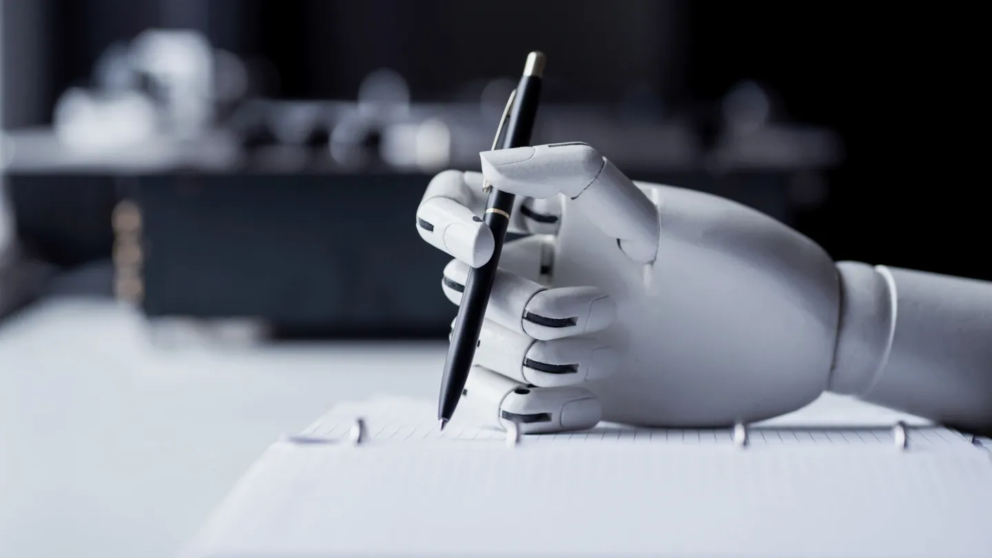 Robot hand writing on paper